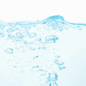 Sfondo azzurro con bolle in aumento che simboleggiano la modalità Degas nei pulitori ad ultrasuoni ASONIC.